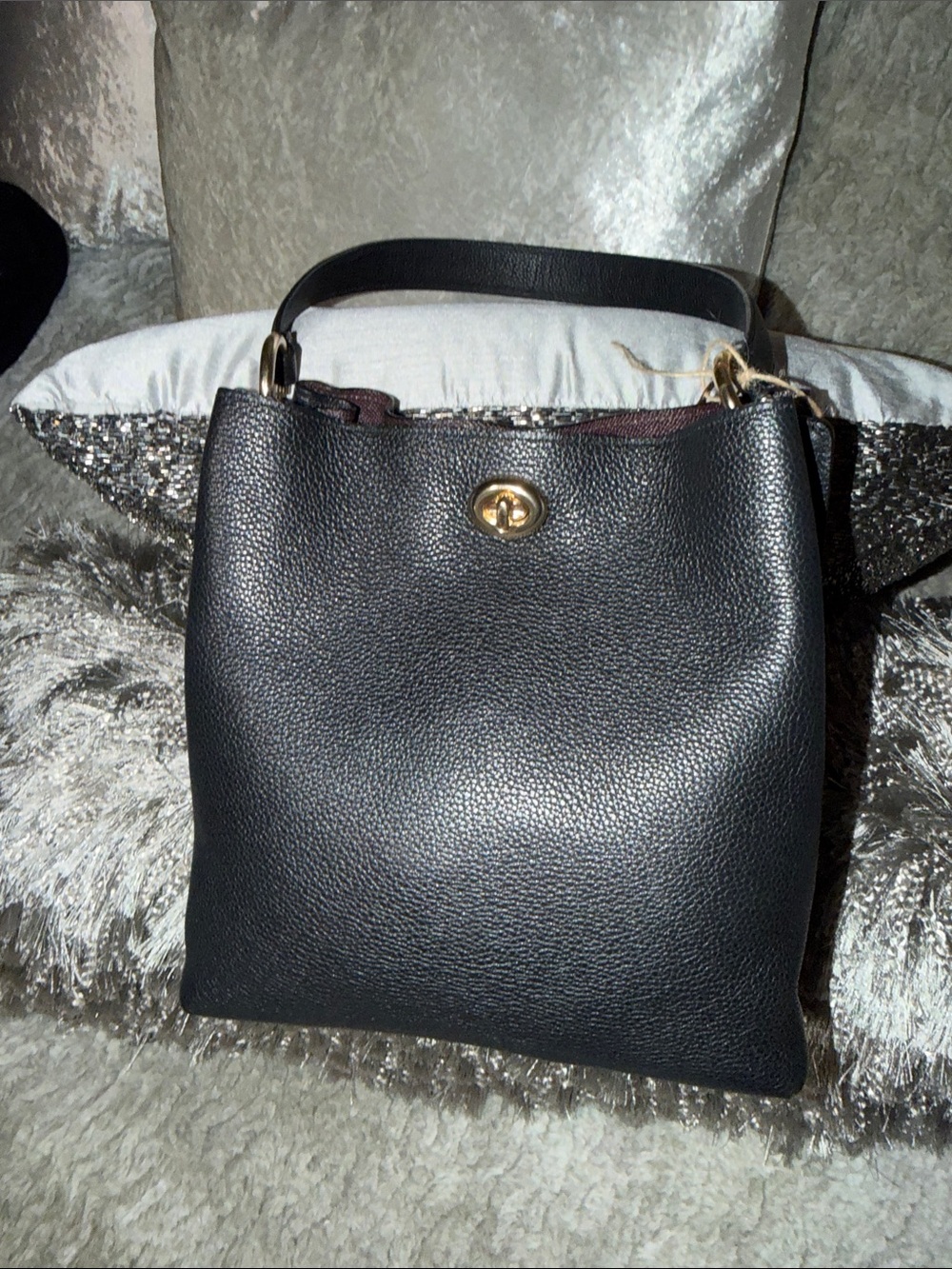 Coach bucket bag, likely the Charlie or Town model